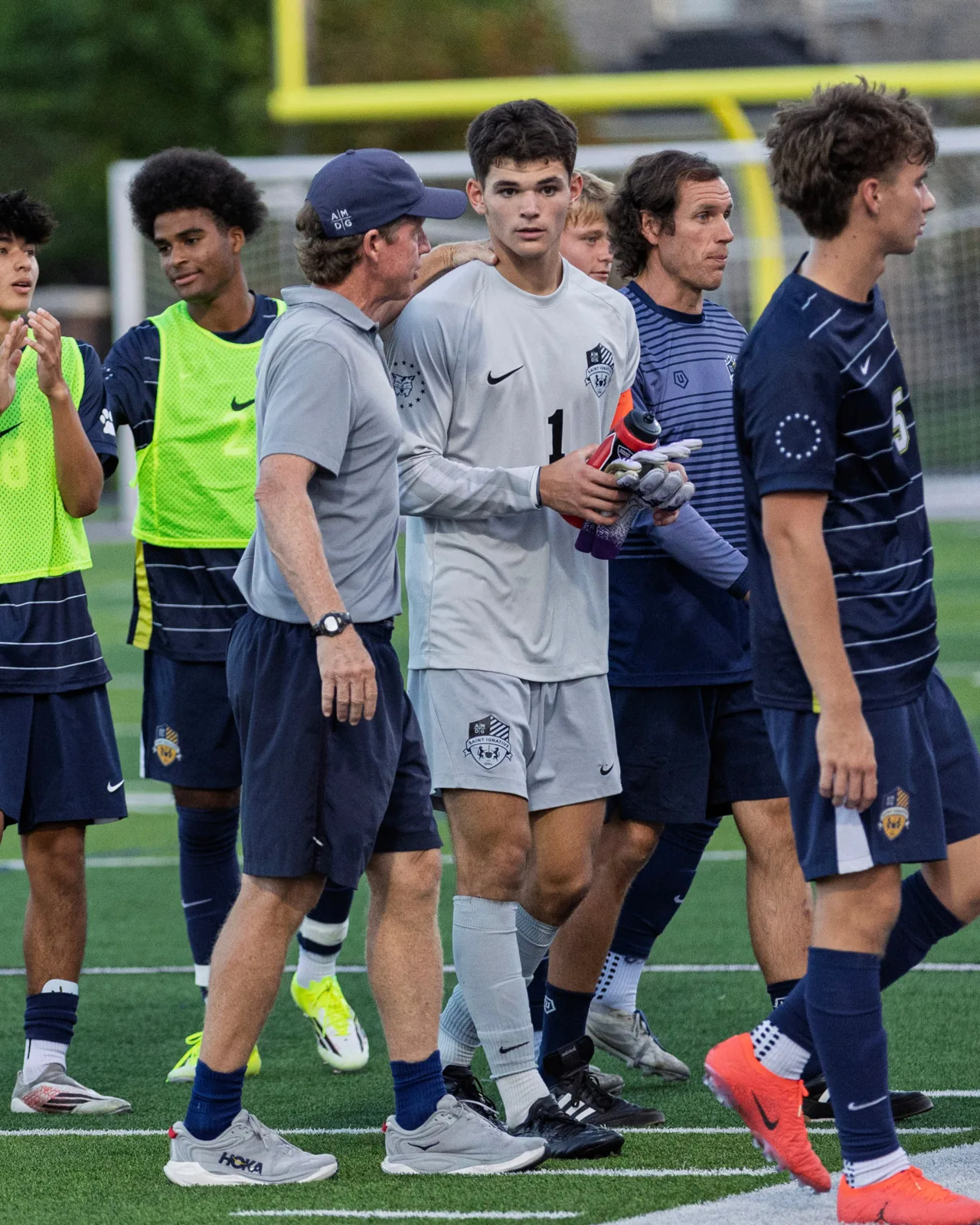 Walking off with Coach after the final whistle