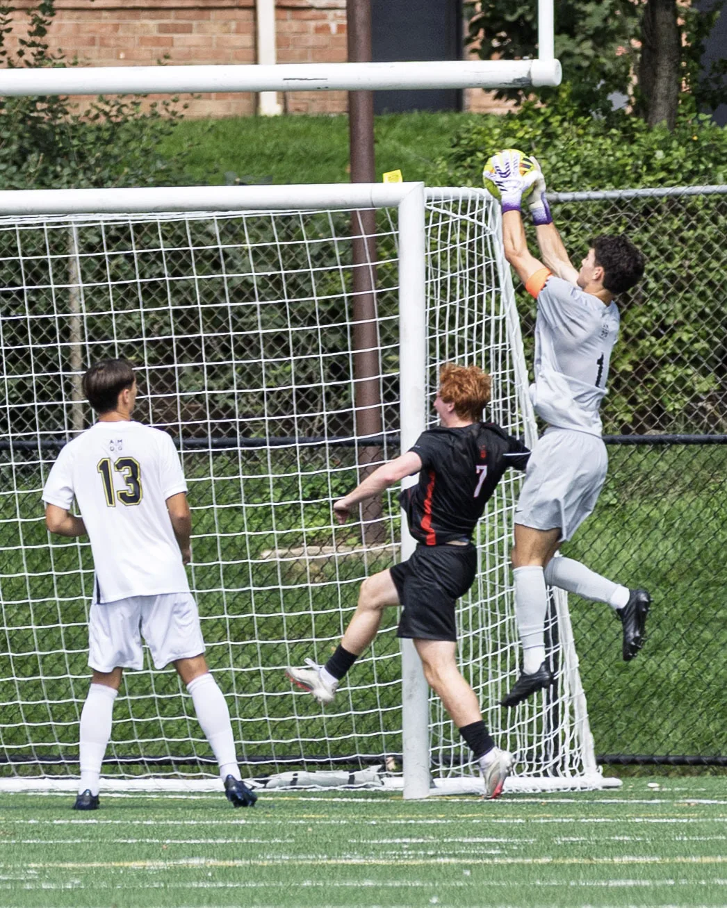 High claim at the top corner under pressure