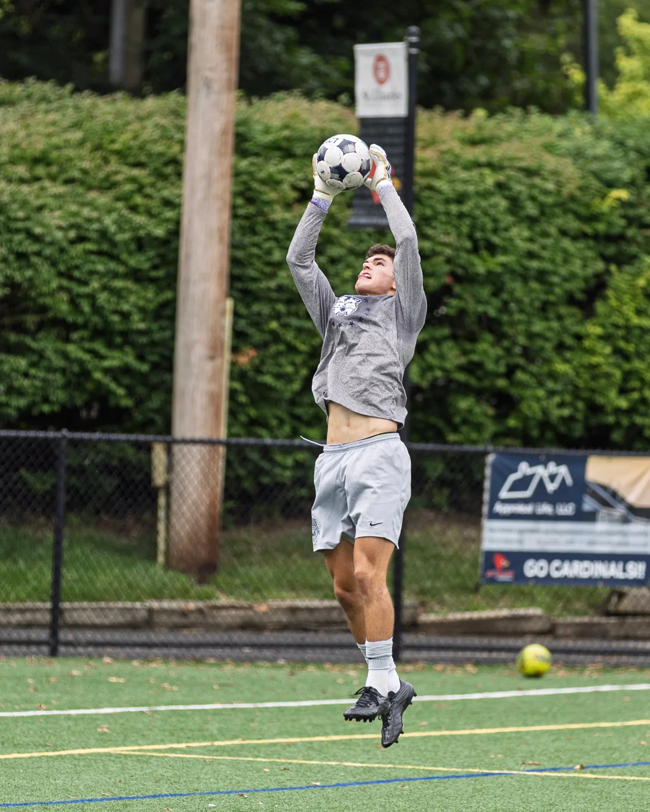 Rising for a high catch in warmups